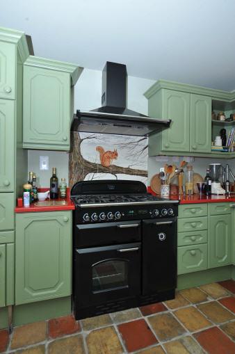 electric and gas range with two ovens, grill and five ring gas hob; matching black canopy with towel