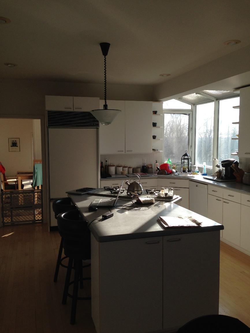 BEFORE PHOTO: #1 Awkward shaped island with gas cooktop and down draft venting, minimal seating,