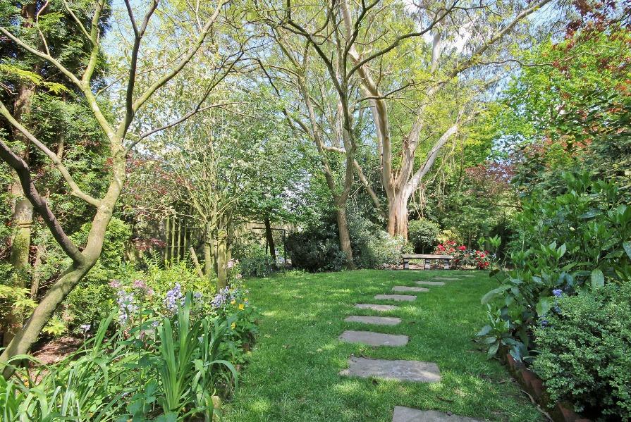 Side access leads to the stunning rear garden which is formed from what were the gardens for the two original cottages.