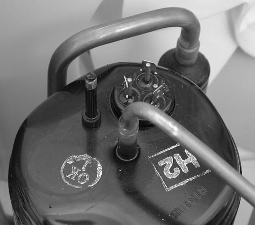 g) Remove the three rubber isolators from the compressor.