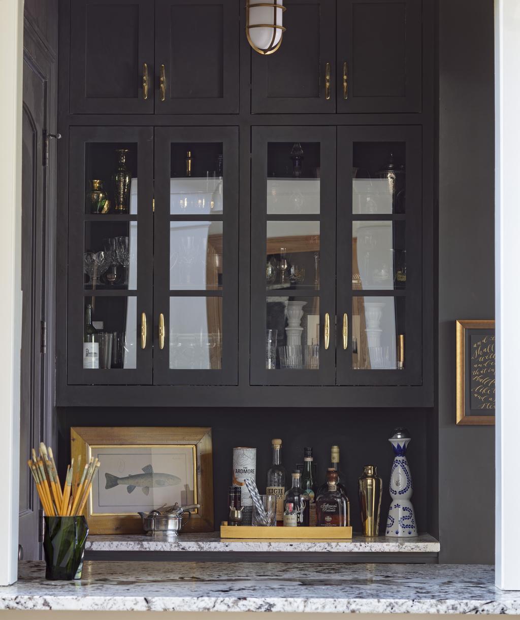 Checking in: the elevator vestibule features a built-in bar An airy vignette n the foyer This house is incredibly open, but still cozy. How did you manage that balance?