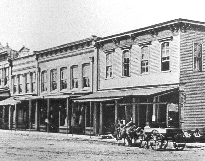 of the young town. It was not until 1857 that a courthouse stood in its designated central location.
