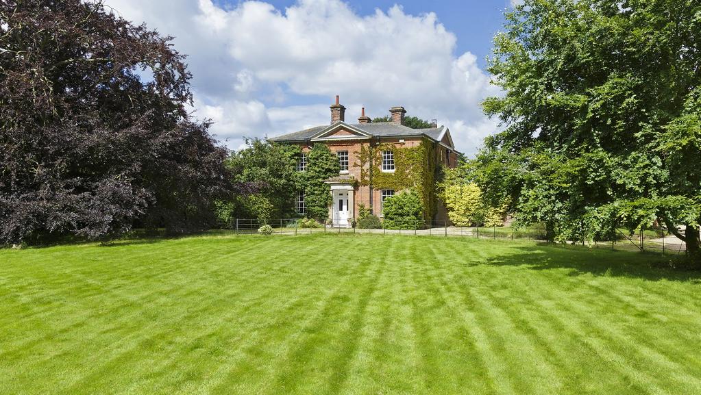 A FINE GRADE II LISTED FORMER RECTORY SET IN