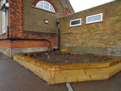Figure 2 Bio-retention bog garden with seating showing disconnected downpipes and overflow drain