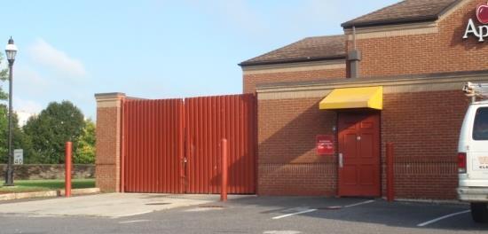 Rear fence and evergreen screening Enclosure as part of rear loading area Collection Area