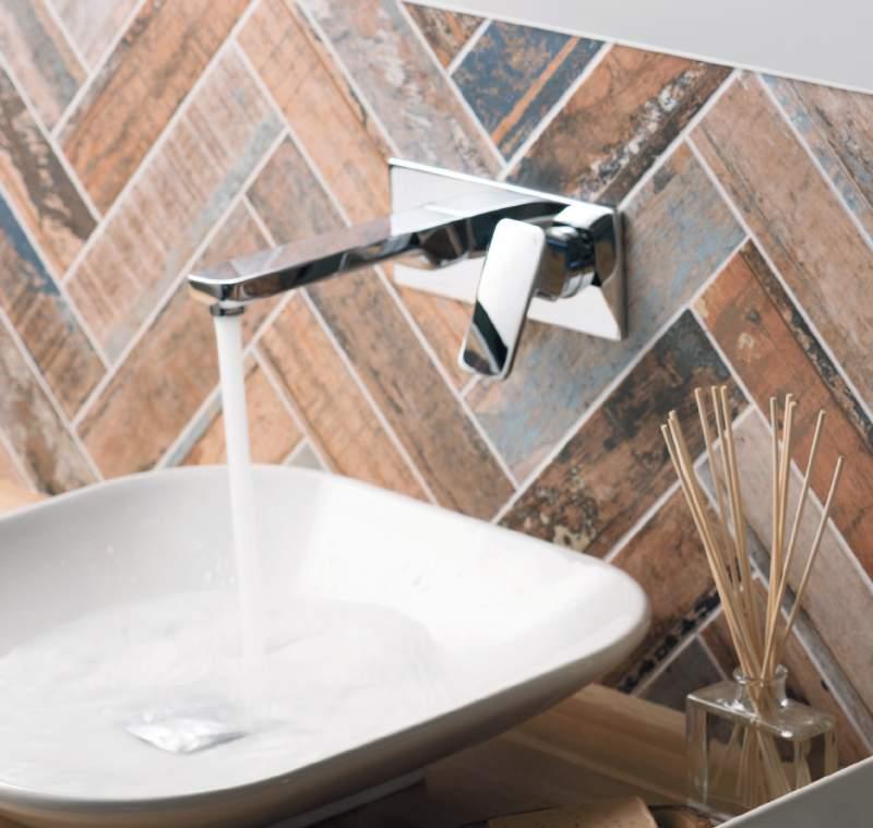 PHASE The tapered angles of this eye-catching collection bring a note of boldness to the bathroom.