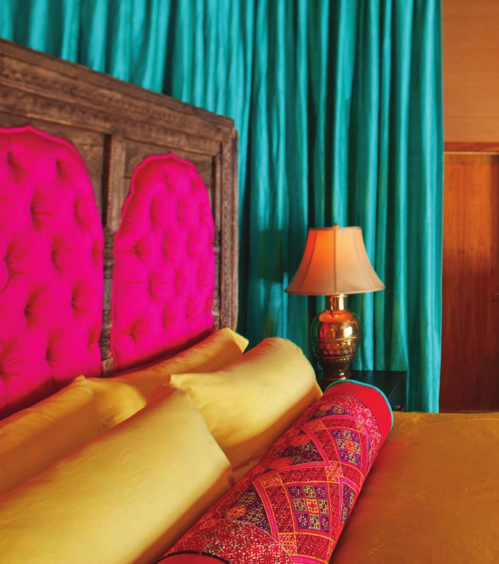 The golds blues and reds in the atfields bedroom were inspired by a hinese painting opposite page that they bought on