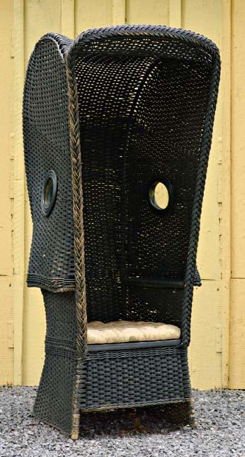 painted black, circa 1920. The chair measures 66½ inches high, 30 inches wide and 30 inches deep.