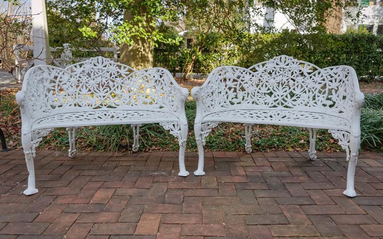 Pair of curved zinc garden benches in the Passion Flower Vine pattern, circa 1900, 31 inches high