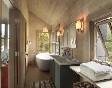 The master bathroom (below left) is long and narrow, with the tub tucked into a corner with windows on two