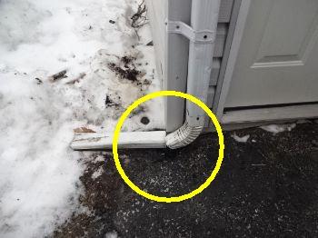 Recommend extending the downspout to drain further away. Curved end piece of the downspout has fallen off.