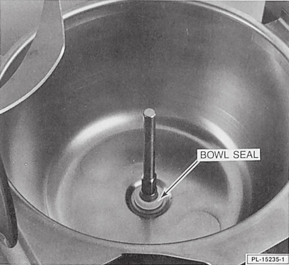 Bowl Seal: Insert the black seal ring in the groove of the white seal retainer so the thin black edge is down and the tapered white part on the retainer is up (Fig. 2).