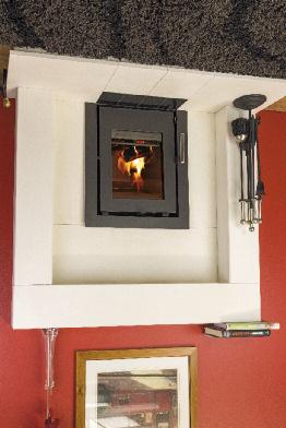 to flammable materials mm At the sides Behind stove Behind with optional heat shield 200 300 150 n/a n/a 200 300 200 300 250 300 A modern and stylish inset stove that is designed to fit into a