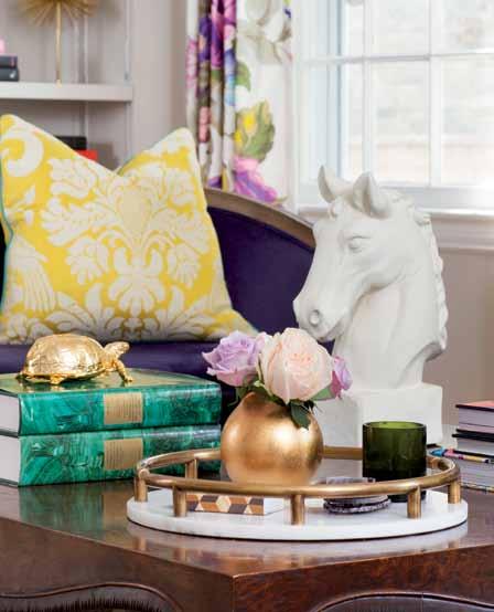 Designer Erica Burns searched for colorful books online to augment her client s existing collection and fill out the built-in shelving in the family room.