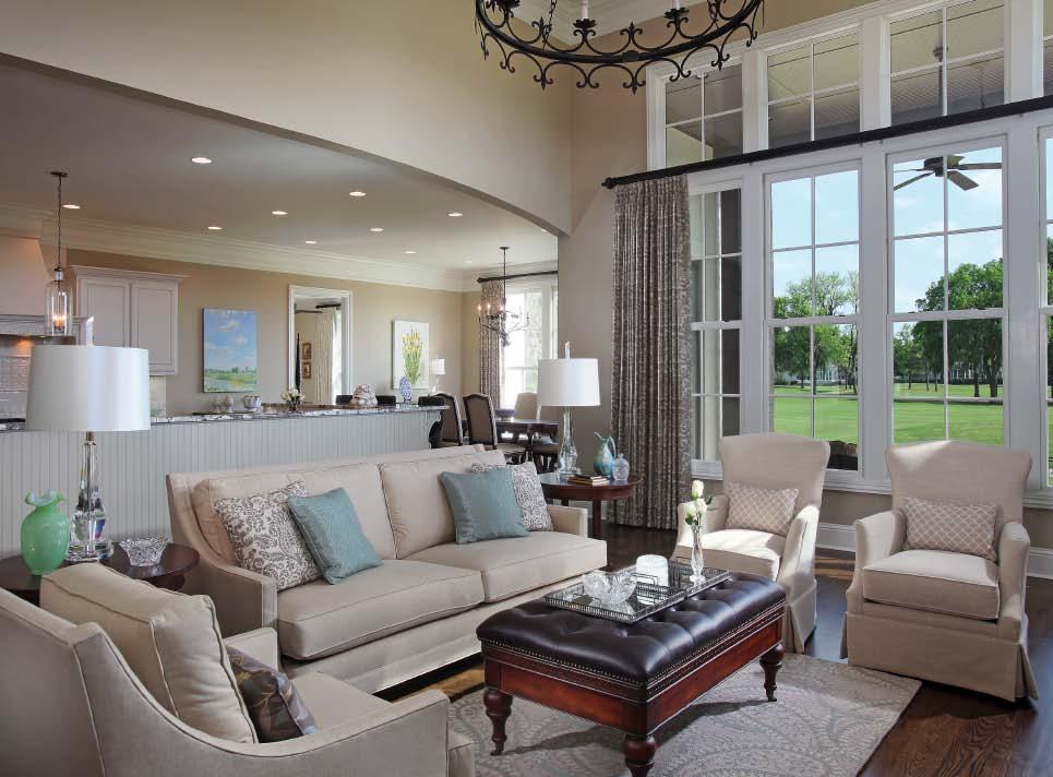The living room, kitchen, and breakfast room are all open to each other to create a perfect space for entertaining.