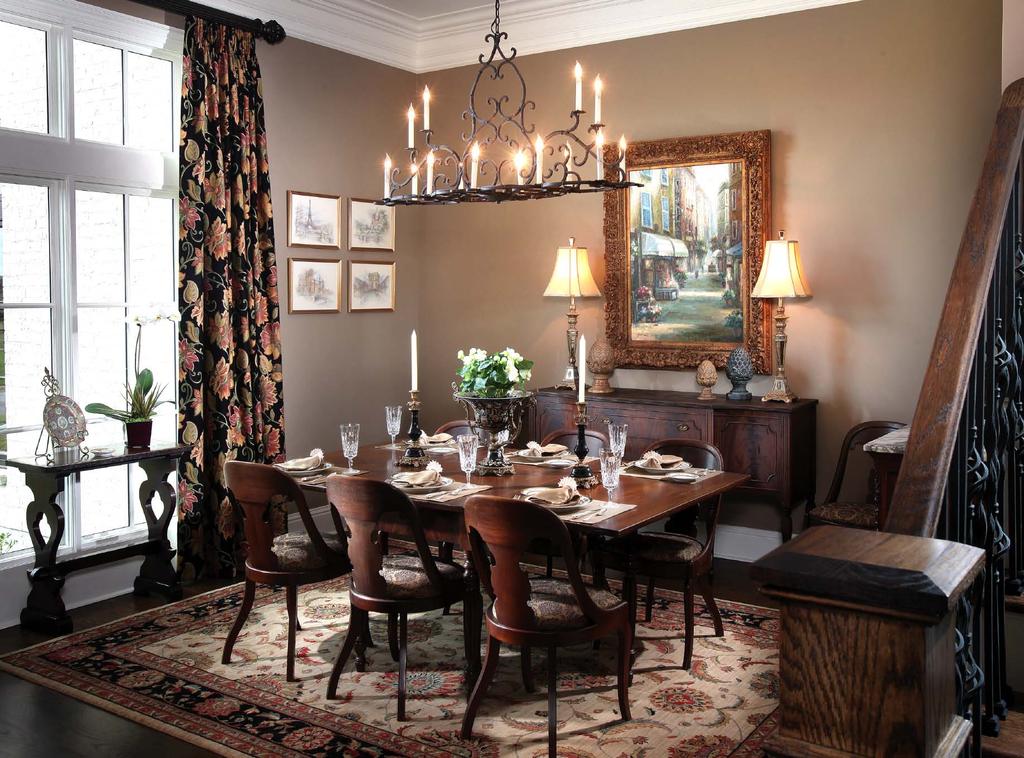 Heirlooms in the elegant dining room include the mahogany dining table with a double gate leg, and the Empire-style chairs. enhance the richness of the many interesting and beautiful pieces.