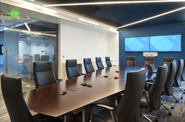 Color, natural light and unique furniture systems give the office energy and vitality. Angular walls take cues from JDA s corporate brand.