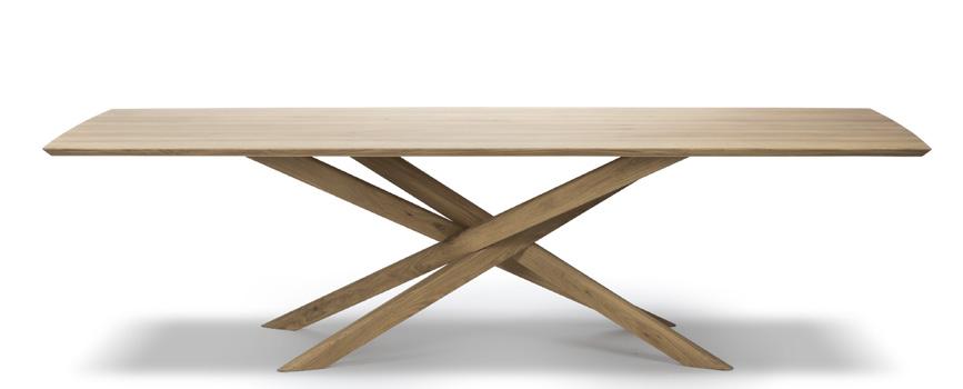 to come. OAK MIKADO DINING TABLE In-house designer Alain Van Havre designed a successful dining table with interlocking legs.
