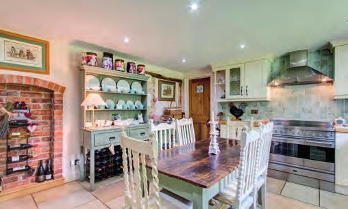 Detached annexe comprising: Sitting room open to kitchen, two double bedrooms and bathroom.