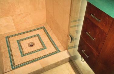 n Custom inset tiles in the shower were part of the finishing touch to attract sophisticated buyers. The ensuite bath had a large soaker tub installed.