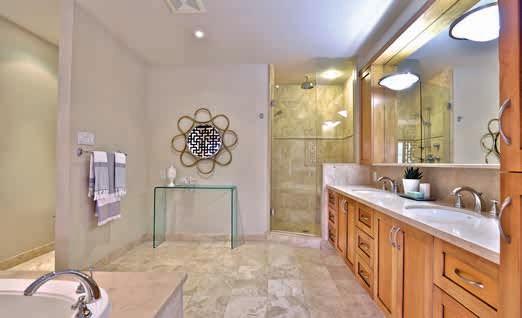Ensuite Heated travertine floors Pocket door Custom vanity with his and hers Kohler sinks with polished travertine countertop His and her medicine cabinets Separate shower with