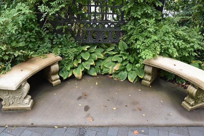 Two benches are currently at this location, which can be moved or replaced. The provided footprint for the base of the sculpture is approximately 4 deep x 9 wide.