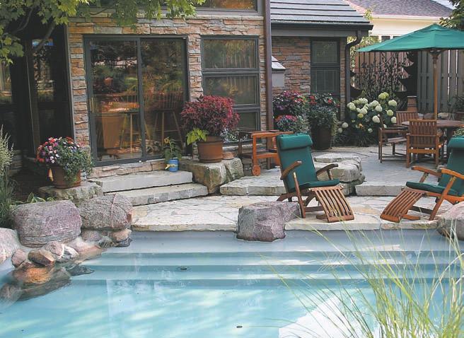 a Guests can enter the pool just outside the kitchen, where a shady seating area shelters
