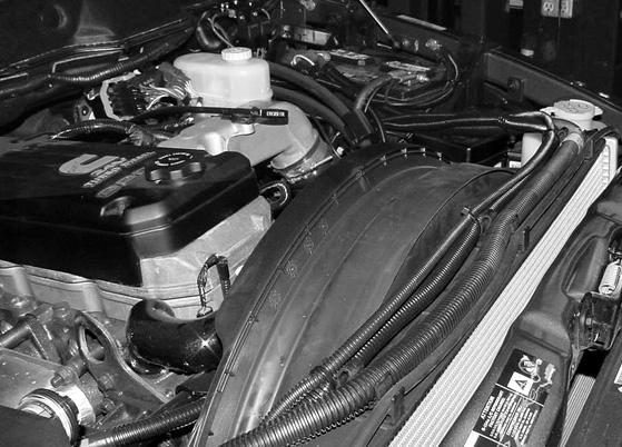 INSTALLATION BLUEHEAT - DODGE RAM 500 / 3500 Route the fuel line () along fuel pump harness () and vehicle lines toward the engine