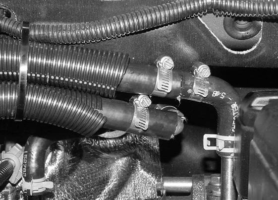 Connect Webasto heater inlet hose (3) to heater core coolant hose () using 90 degree copper reducer (4) and two hose clamps ().