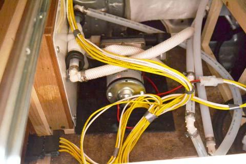 SECTION 7 PLUMBING Water Pump (Remove lower drawer in galley to access) -Typical View Replacing the Cold Water Filter Cartridge You should replace the filter cartridge every season and when water