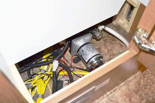 SECTION 7 PLUMBING Shower Pump (Located beneath galley cabinet access panel) -Typical View To clean the shower pump filter Ensure the Shower Drain switch is OFF.