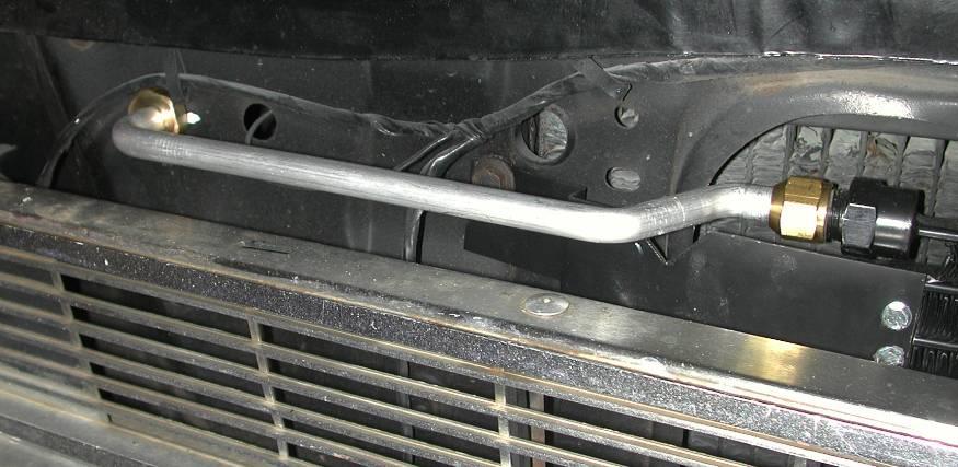 The condenser is inserted from engine side of the radiator support. Reinstall radiator using the original hardware.