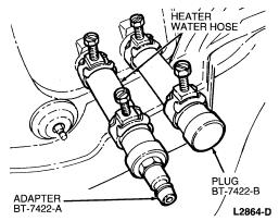 2. Disconnect the heater water hoses from the heater core tubes. 3. Install a short piece of heater water hose, approximately 101 mm (4 inches) long on each heater core tube. 4.