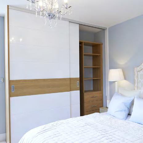 suit any interior scheme. Jericho sliding wardrobe doors shown here in a white gloss with an oak band.