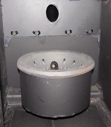 Stuffing box Figure 10 This is a firebox for burning pellets (Figure 10). We recommend you inspect and remove the ashes from the bottom of the combustion chamber at every cleaning.