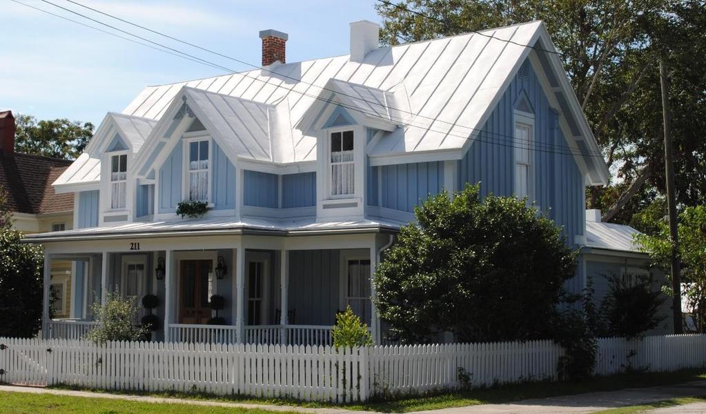 The existing historic standing-seam metal roof was retained and repaired using a liquid