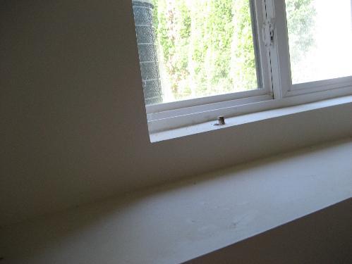 Trim excess bolt. (rear basement window) 1. Flooring Condition Materials: Concrete Garage 2.