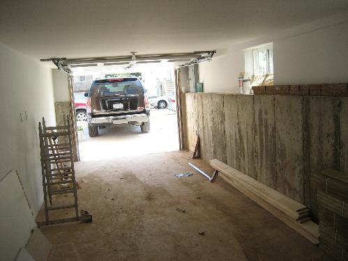 Observations: The clearance between the overhead garage door and the ceiling is minimal.