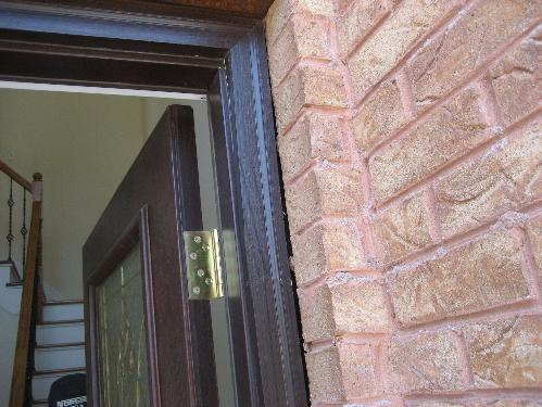 Front door frame needs caulking/sealant. 3. Siding Condition Cracked door jamb.