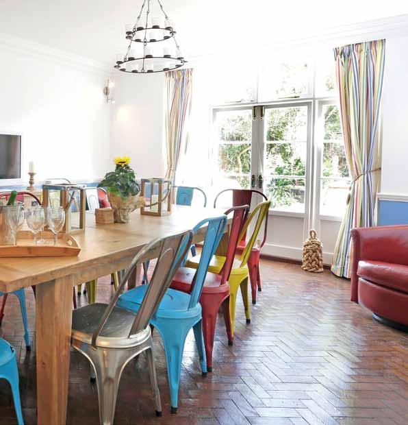In th e know Karen and Kevin s advice on owning a successful holiday home above The cheerful contemporary styled interior includes colourful metal dining chairs below The kitchen was the biggest part