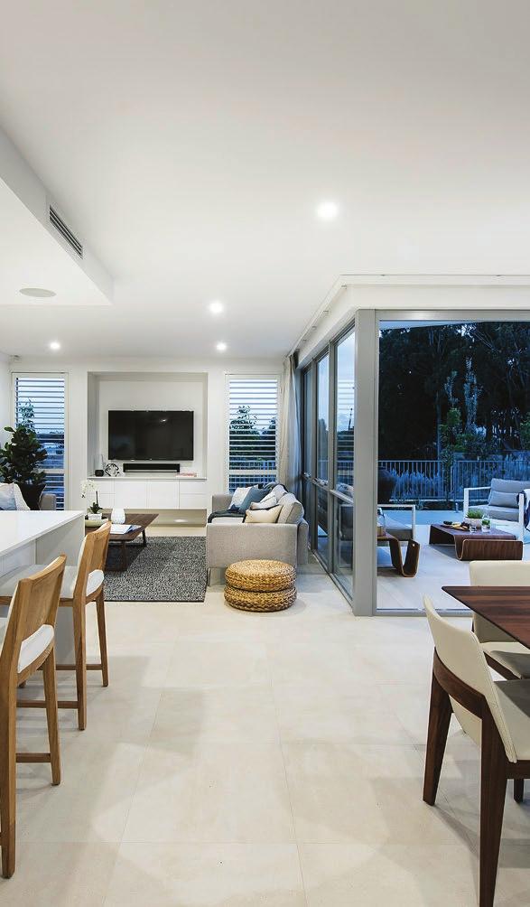 The modern open plan living and kitchen are beautifully appointed with custom cabinetry incorporating a wine cellar, scullery, walk in pantry and laundry.