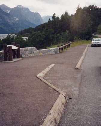 an accessible walk in front of the wheel stops as shown to the