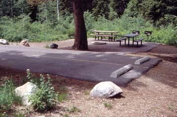 Campground Use Pads Tables, tent pads, and fire grates are standard furniture for a campground.