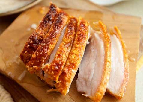 Turn over your belly and take 2 tablespoons of Chinese five spice and rub into the flesh of the pork avoiding the skin.