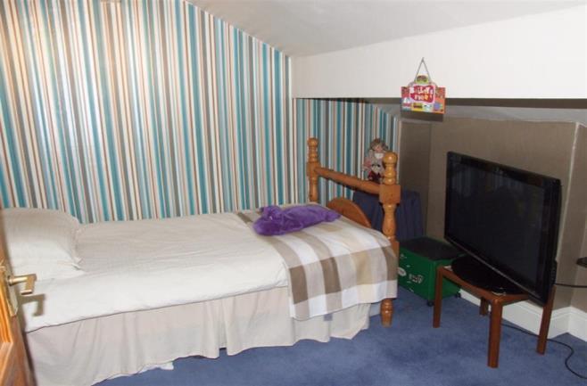 Wood panelled ceiling, front facing double glazed window and wall mounted heated towel rail plus electric heater. BEDROOM 3 3.