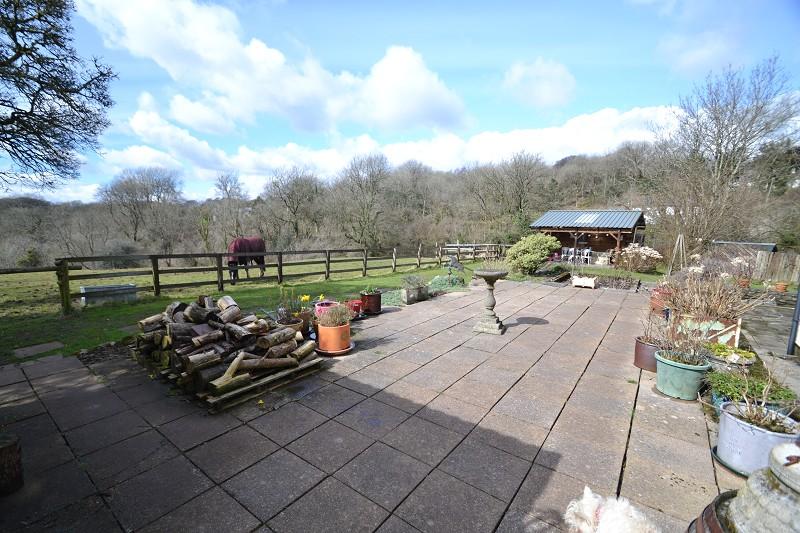off chicken coop, wooden open summer house, a lovely selection of fruit trees.