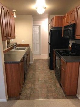1. Kitchen Room Kitchen Walls and ceilings appear in good condition overall. Flooring is vinyl. Accessible outlets operate. Light fixture operates. Sink and faucets are in operable condition overall.
