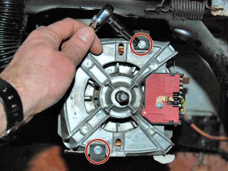 Step 13 Remove the motor retaining clip screws