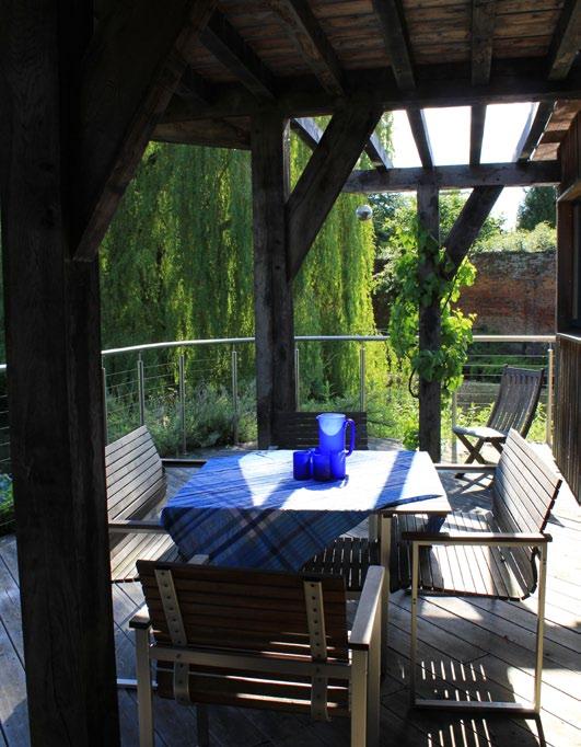 A raised paved terrace, ideal for alfresco dining, adjoins a petanque piste and an outdoor swimming pool with surrounding decking, all overlooking the garden and countryside beyond.