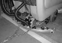 MAINTENANCE 1. To winch the machine onto the truck or trailer, attach the winching chains to the rear tie down locations on either side of the machine frame by the rear casters. 2.